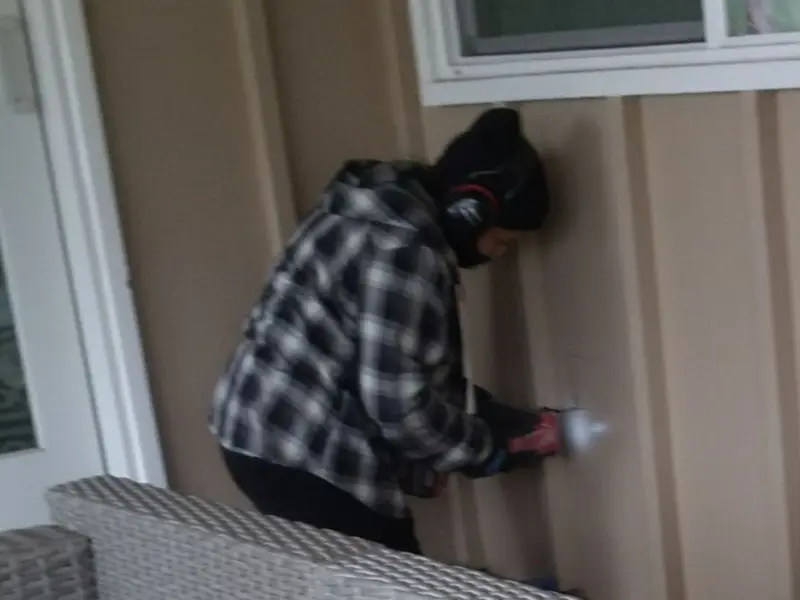 Professional electrician installing an exterior outlet in Hoboken