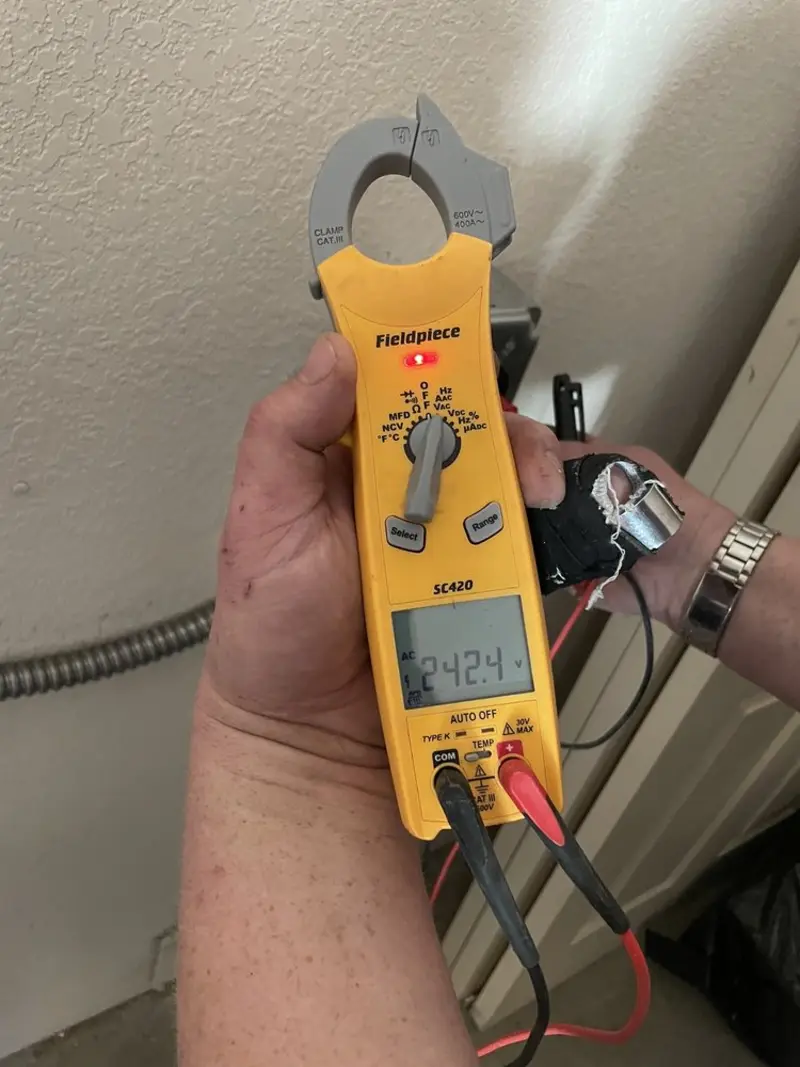 Voltage testing with clamp meter during Circuit Breaker Repair in Hoboken